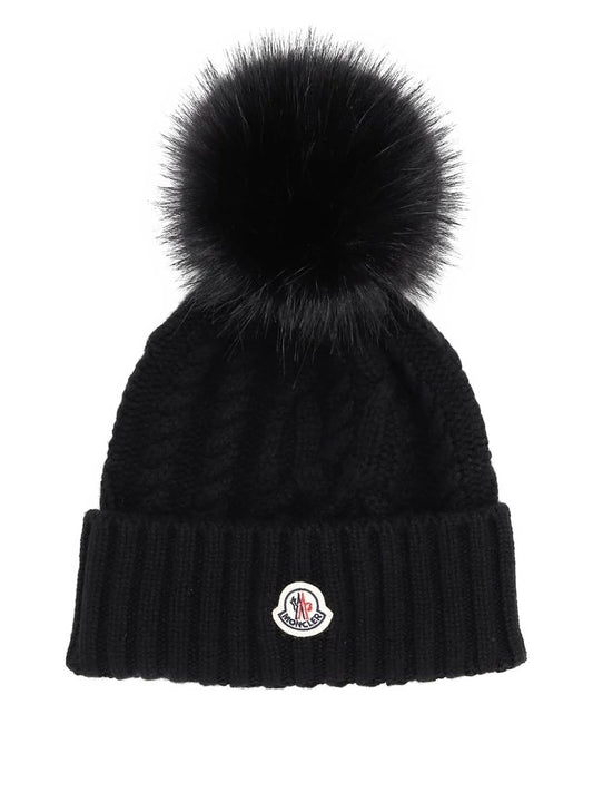 Moncler bonnet en maille torsadée à pompon